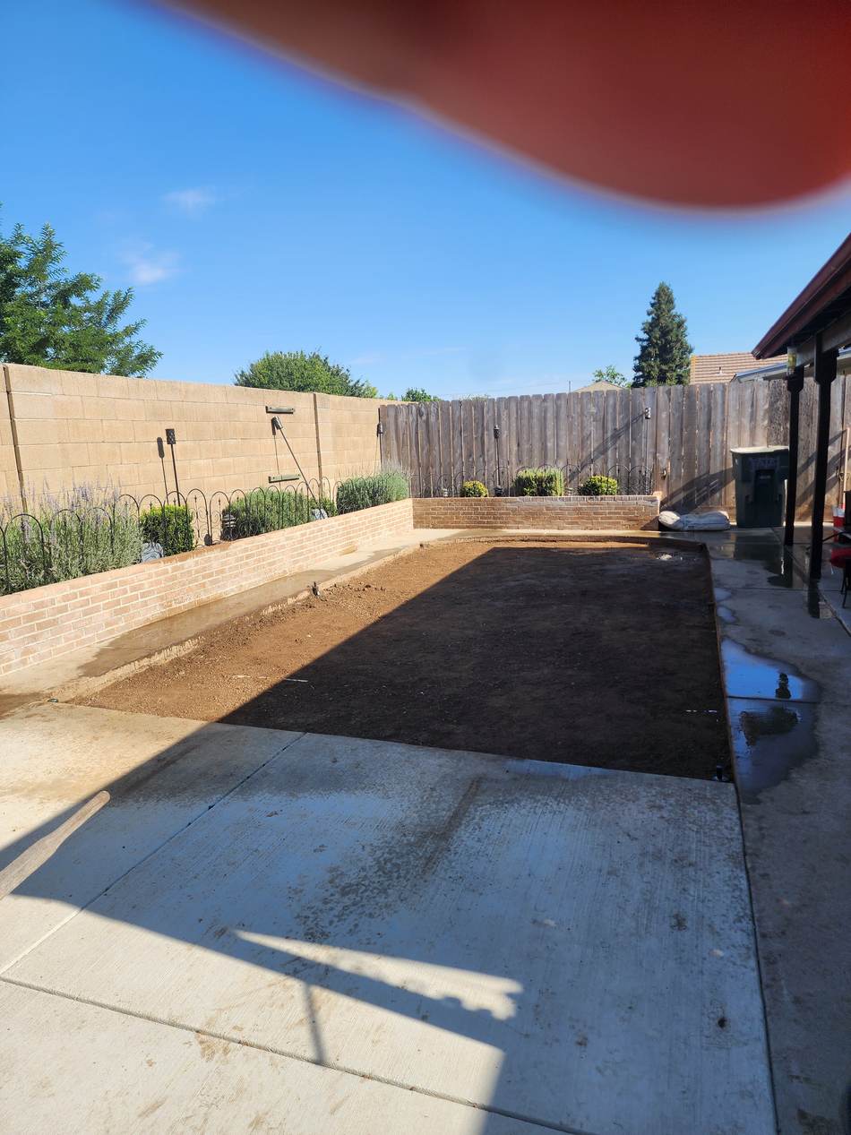 Prepared backyard soil before sod installation in Salida